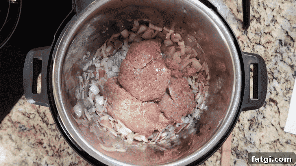 Adding ground meat to pot