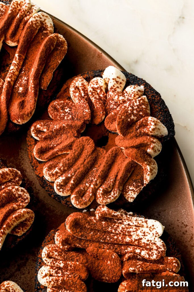 Baked Chocolate Tiramisu Donuts with Mascarpone Cream Recipe 14 close up of chocolate tiramisu donuts with piping