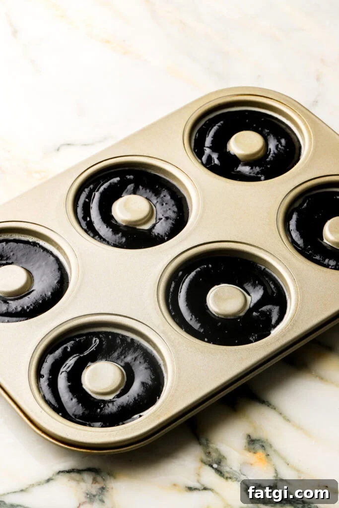 Baked Chocolate Tiramisu Donuts with Mascarpone Cream Recipe 7 chocolate donut batter piped into donut molds