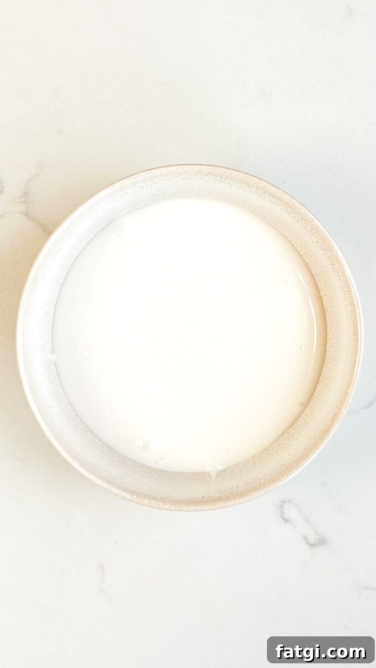 Smooth mixture in a small bowl, before adding food coloring.