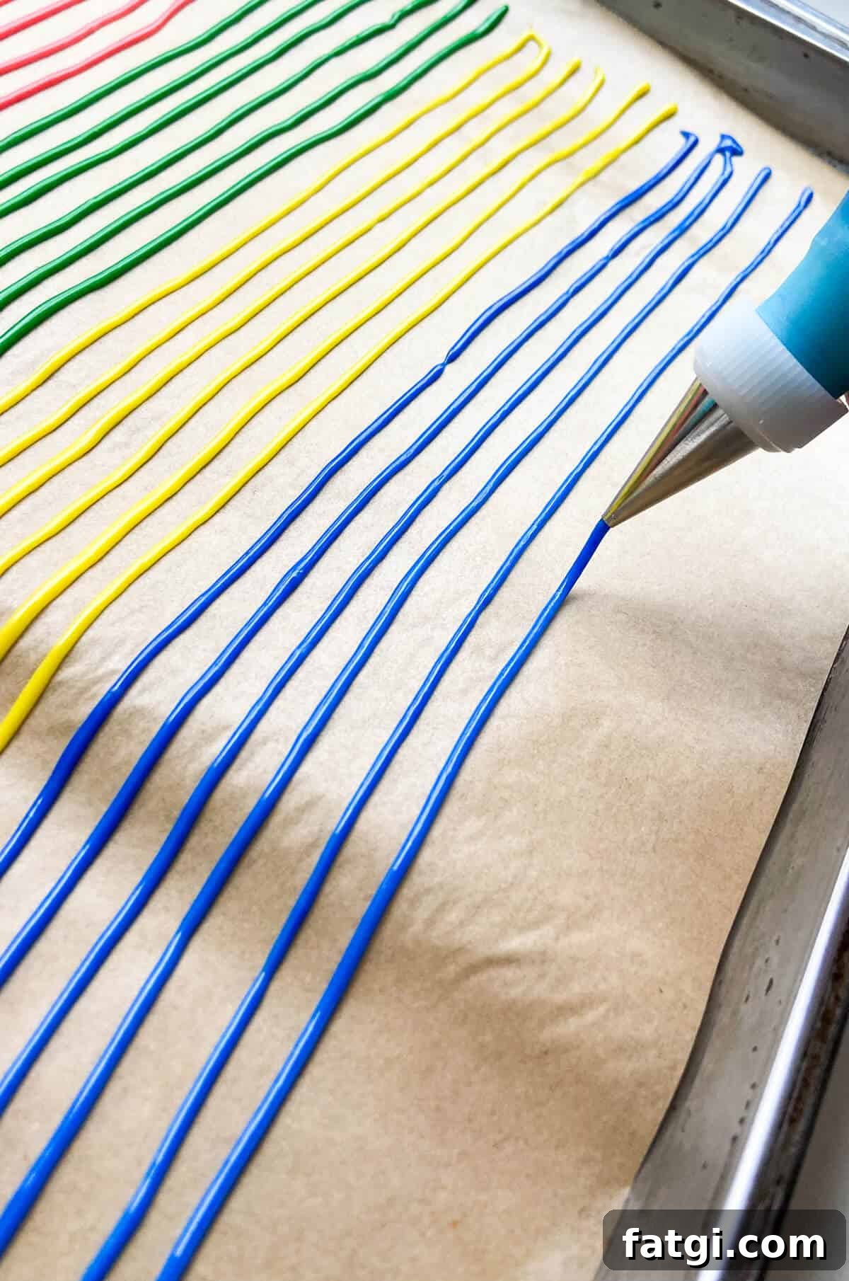 Piping the mixture onto a piece of parchment paper.