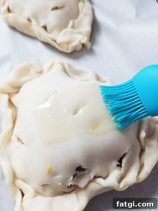 butter being brushed on pastie