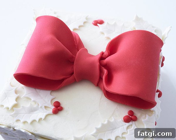 Completed Holly Gift Box Cake with red bow