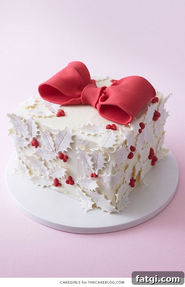 Christmas holly gift box cake on display