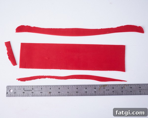 Rolled red fondant rectangle for cake bow