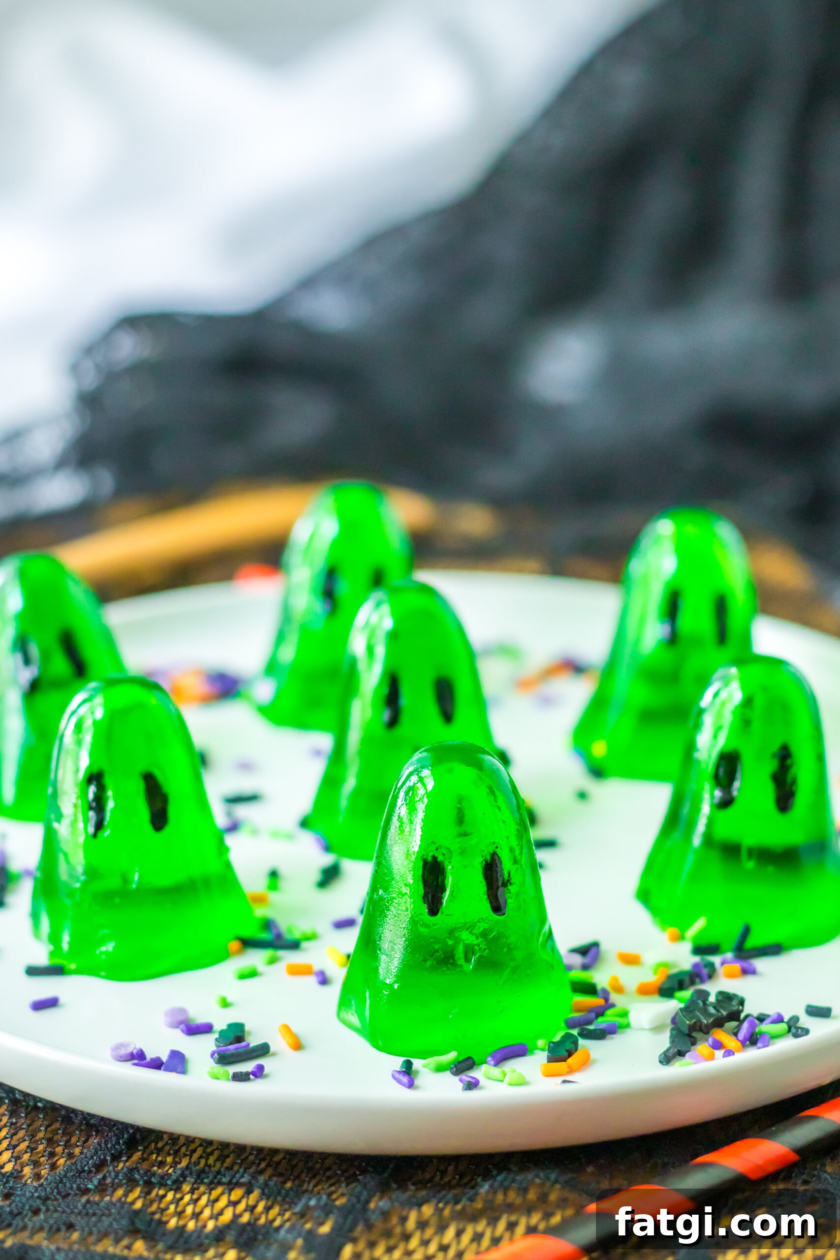 Ghost Jello Shots for Halloween Parties 13 Green shot jello shots on a white plate for halloween