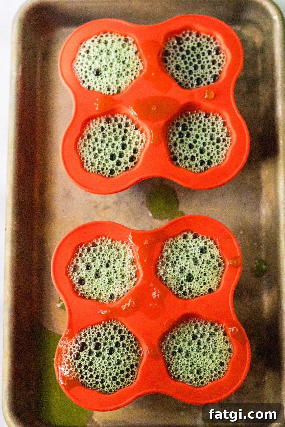 Ghost Jello Shots for Halloween Parties 6 silicone molds on baking sheet filled with jello