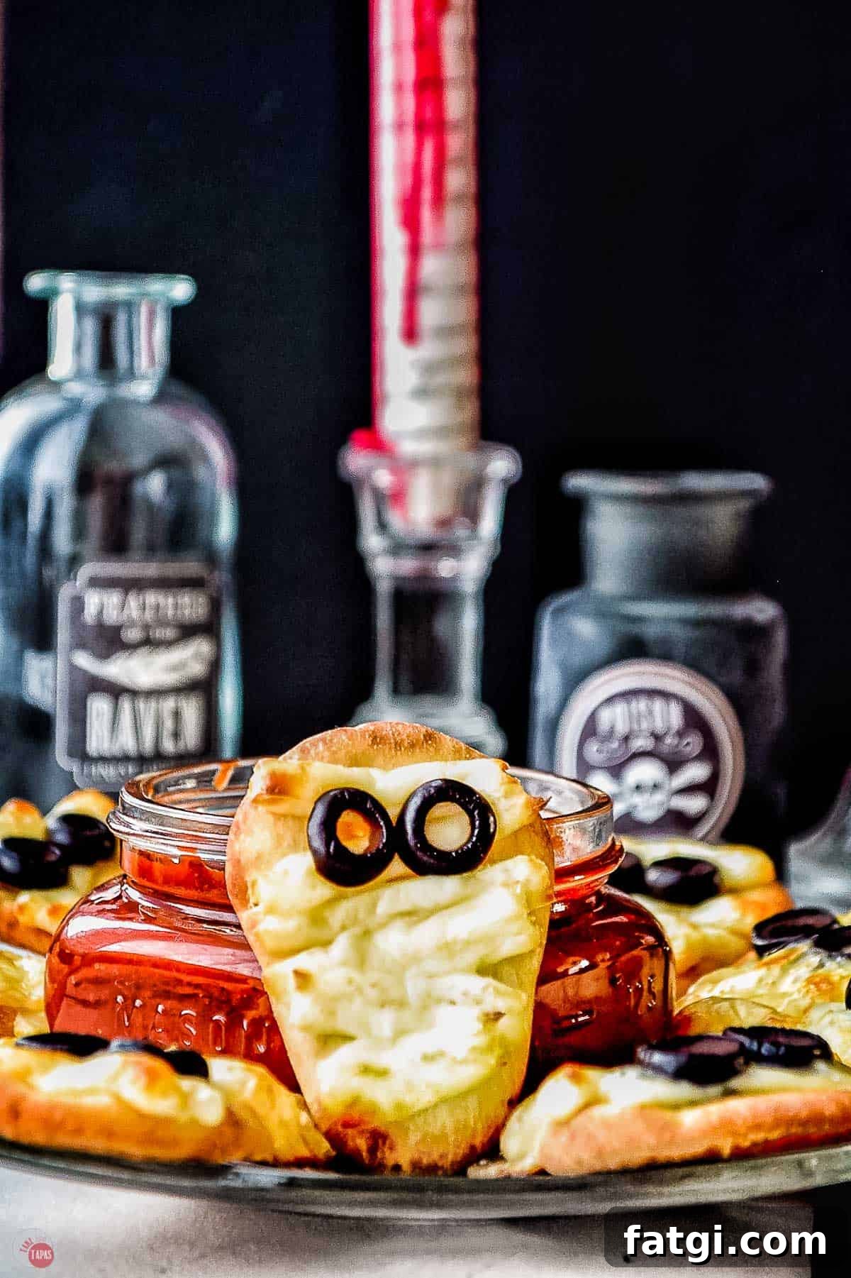 Mini Mummy Pizza Dippers for Halloween 2 mummy flatbread with bloody candles