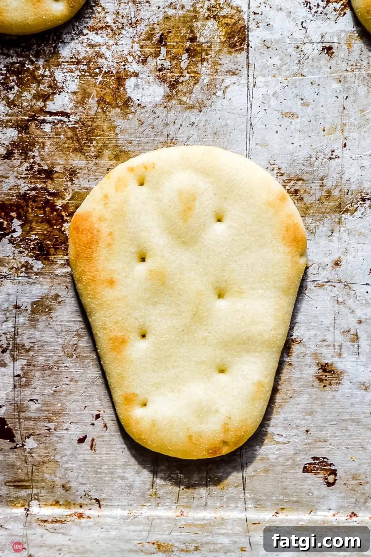 Mini Mummy Pizza Dippers for Halloween 4 naan dipper on baking sheet