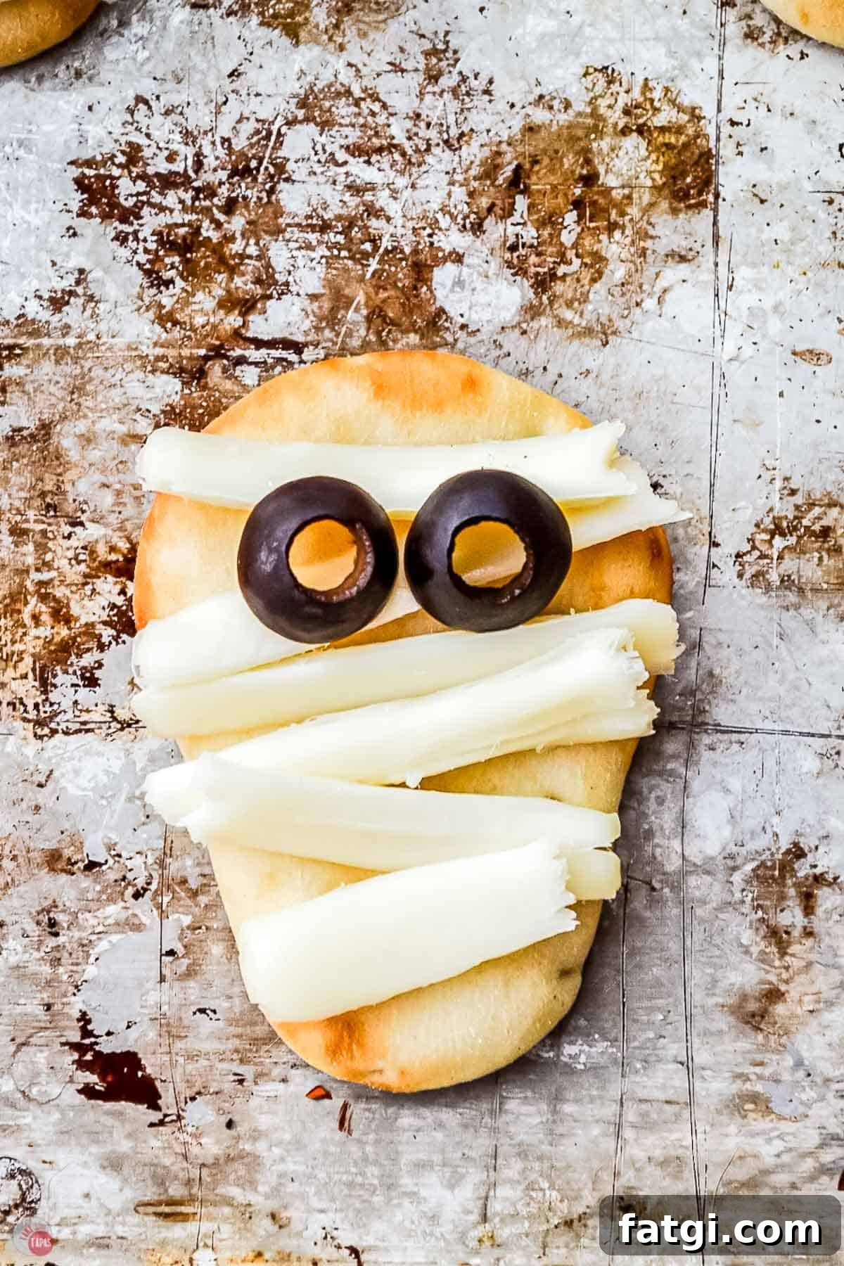Mini Mummy Pizza Dippers for Halloween 6 mummy pizza with olives