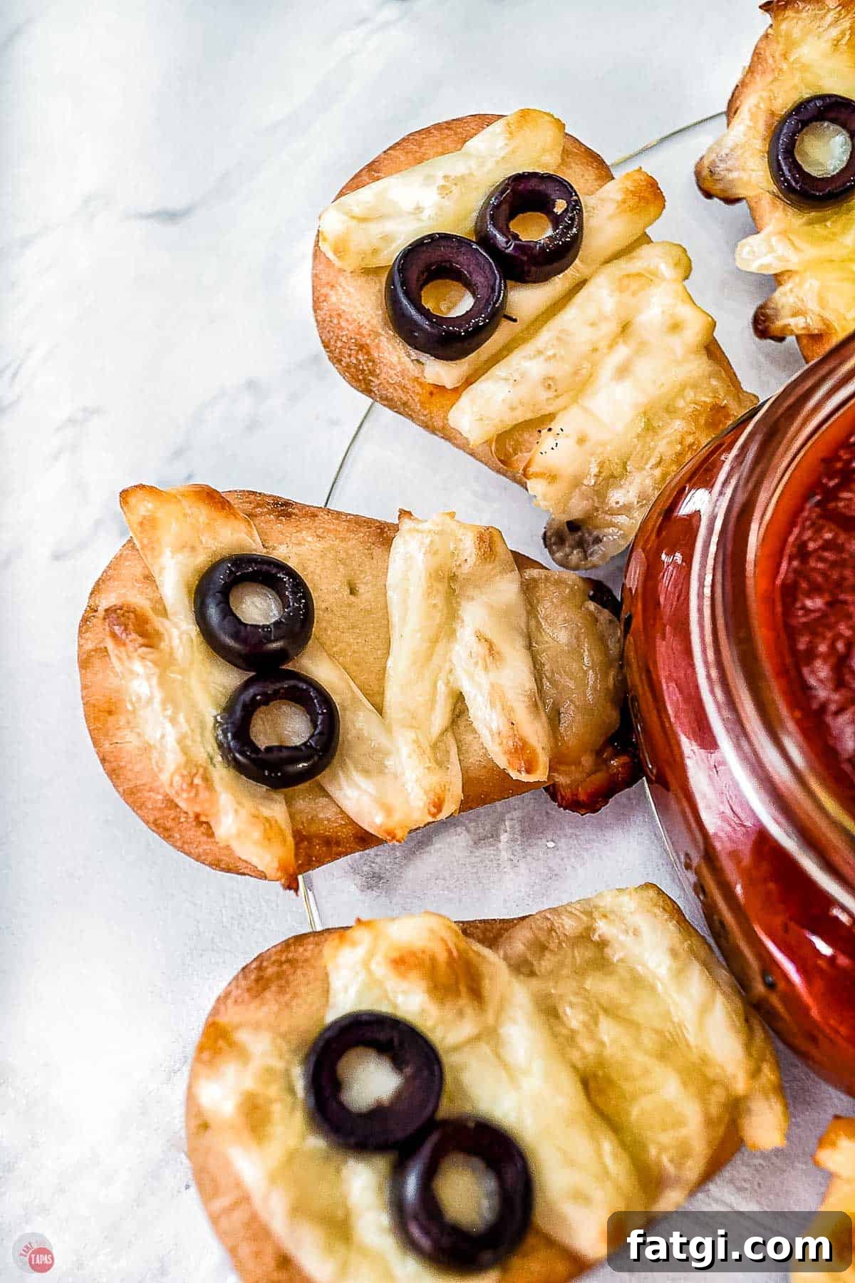 Mini Mummy Pizza Dippers for Halloween 10 naan bread mummy in front of spooky platter