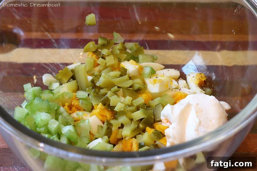 Chopped dill pickle egg salad in a glass bowl.
