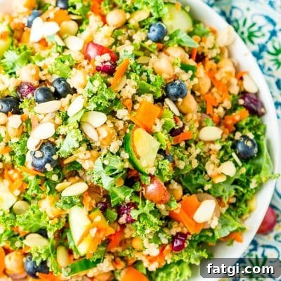 Chopped Kale Salad with kale, grapes, bell pepper, quinoa, carrots, cucumber, Craisins, almonds, and chickpeas.