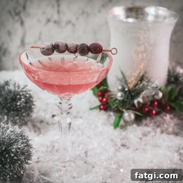 Cranberry Maraschino Sour Cocktail Recipe 15 Gorgeous pink cranberry maraschino sour garnished with iced cranberries on a cocktail skewer.