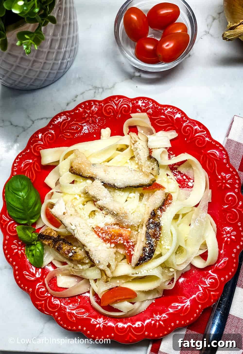 Keto pasta noodles served on a red plate