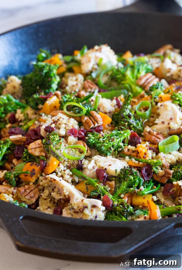Chicken Broccoli Quinoa skillet with scallions, pecans and dried cranberries