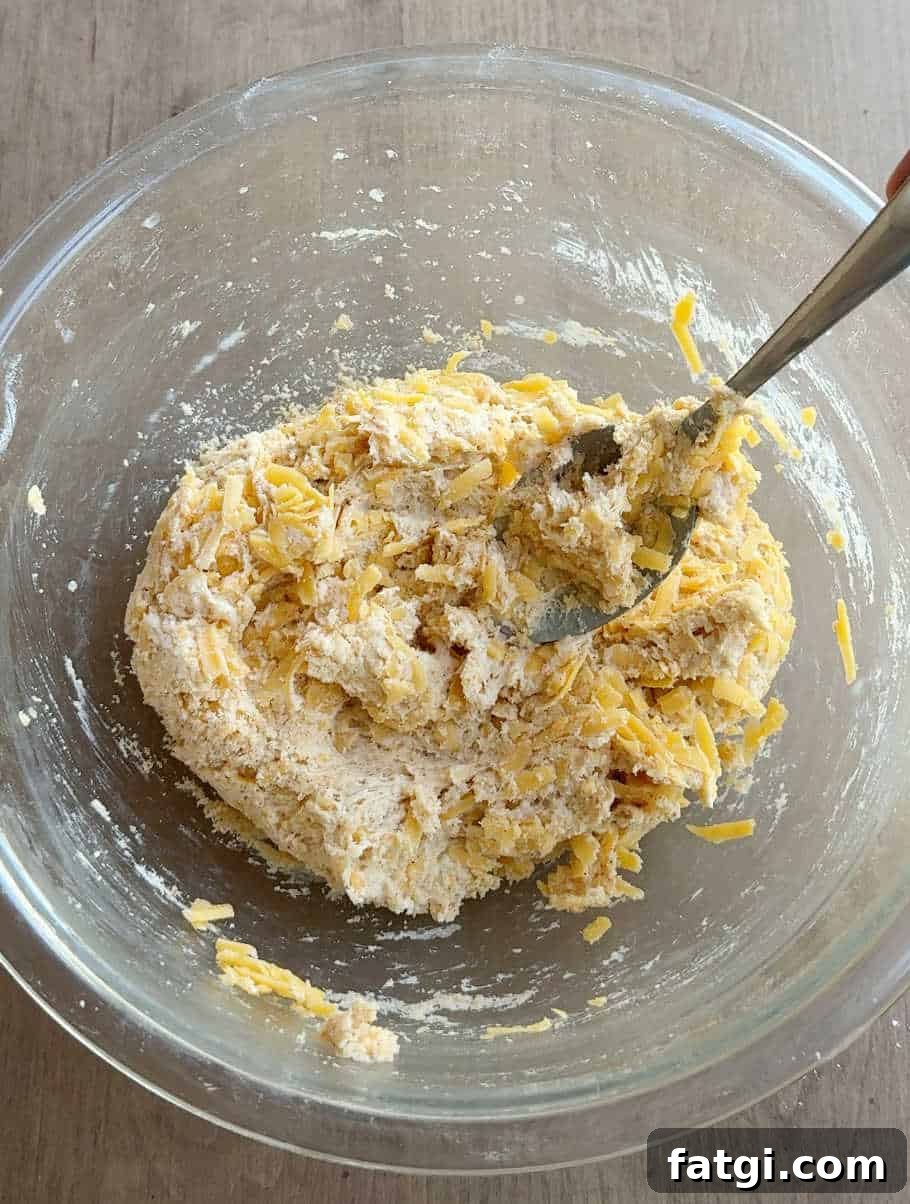 mixing cheese into dough.