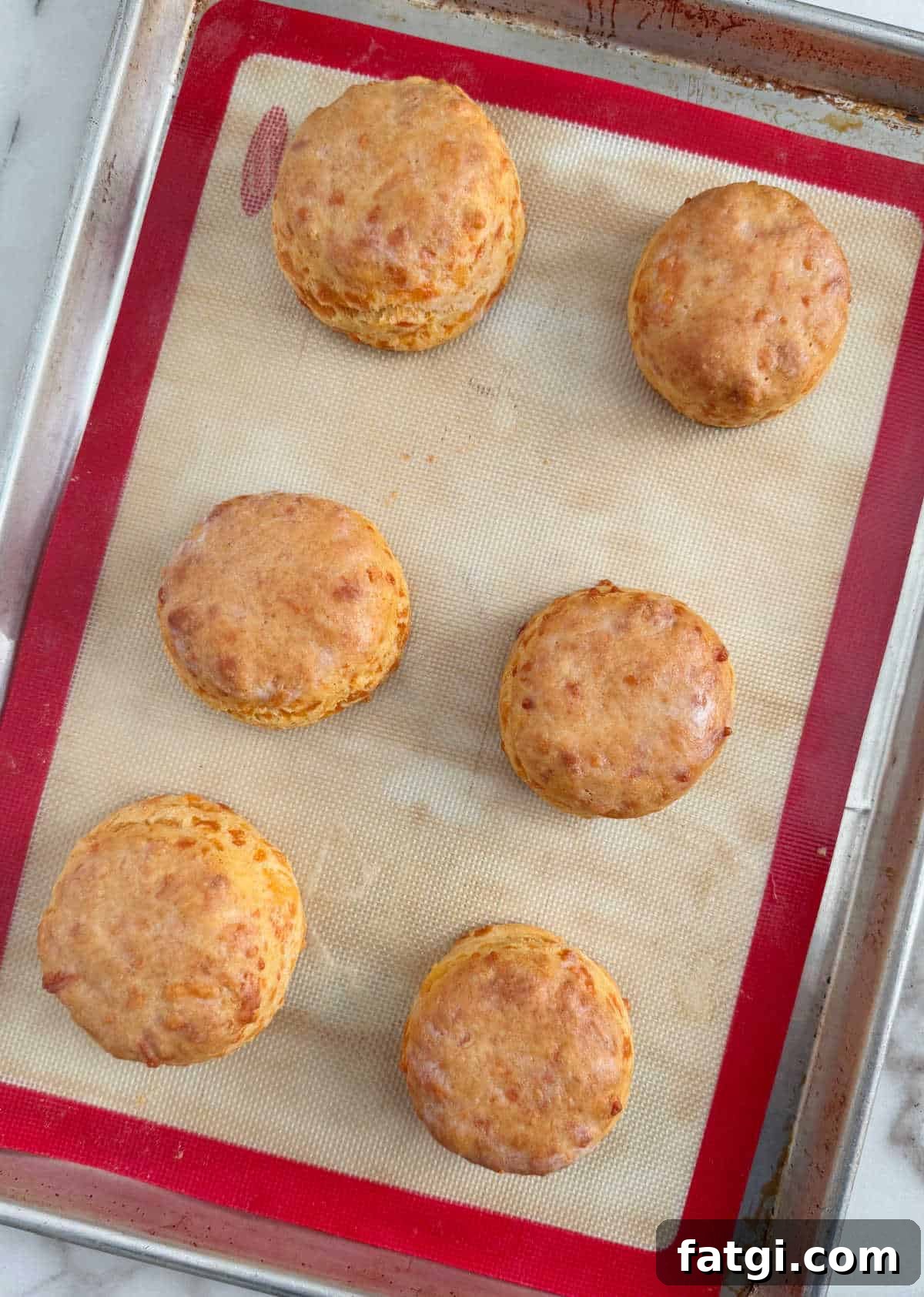 baked sourdough discard biscuits on baking sheet.