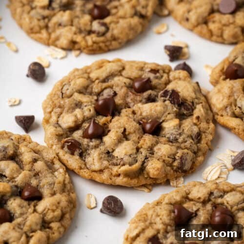 Gluten free oatmeal chocolate chip cookies lying on a baking sheet.