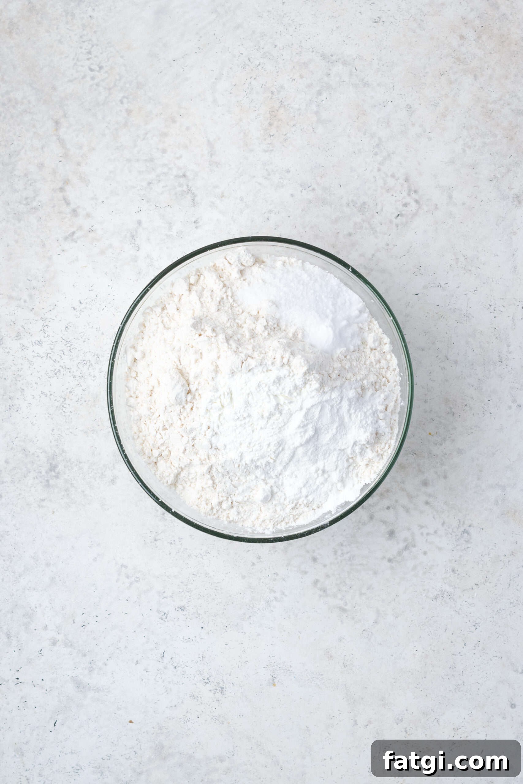 Gluten free flour, cornstarch, baking powder, baking soda and salt combined in a small mixing bowl. 