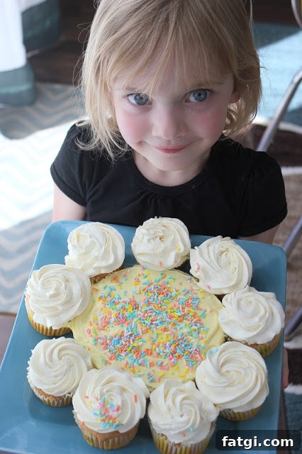 Fun Cake Recipes Kids Can Make at Home 18 9 cupcakes and one round cake decorated like a flower.