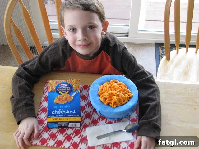 Fun Cake Recipes Kids Can Make at Home 8 Child with finished macaroni and cheese cake.