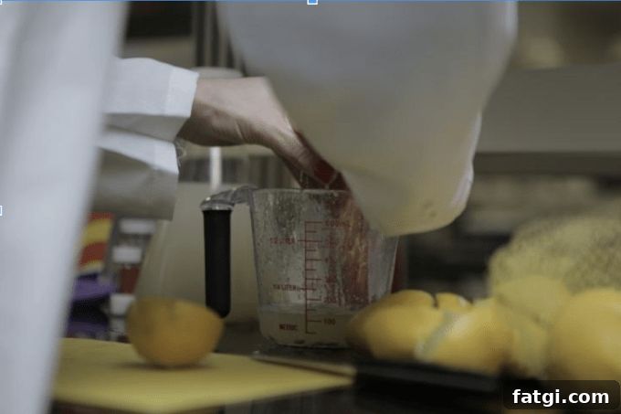 A close up of someone juicing lemons.