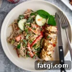 Juicy Marinated Pork Kebabs with Peanut Noodle Salad 12 Grilled pork kebabs served over peanut noodle salad with fresh herbs