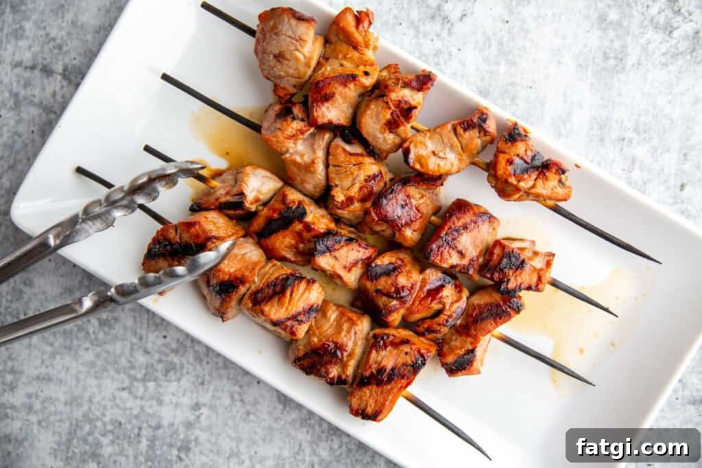 Juicy Marinated Pork Kebabs with Peanut Noodle Salad 7 Pork kebabs grilled on barbecue until browned and caramelized