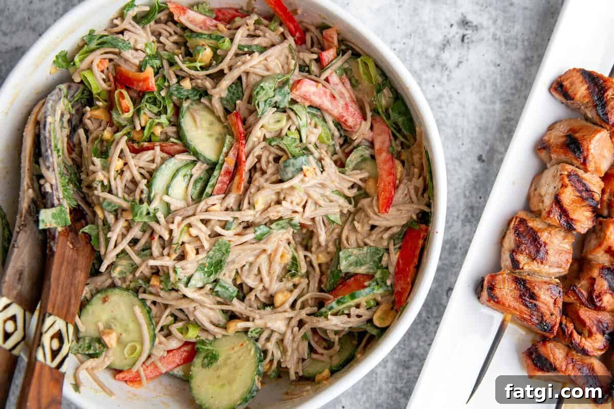 Juicy Marinated Pork Kebabs with Peanut Noodle Salad 8 Plated pork skewers with creamy peanut soba noodle salad