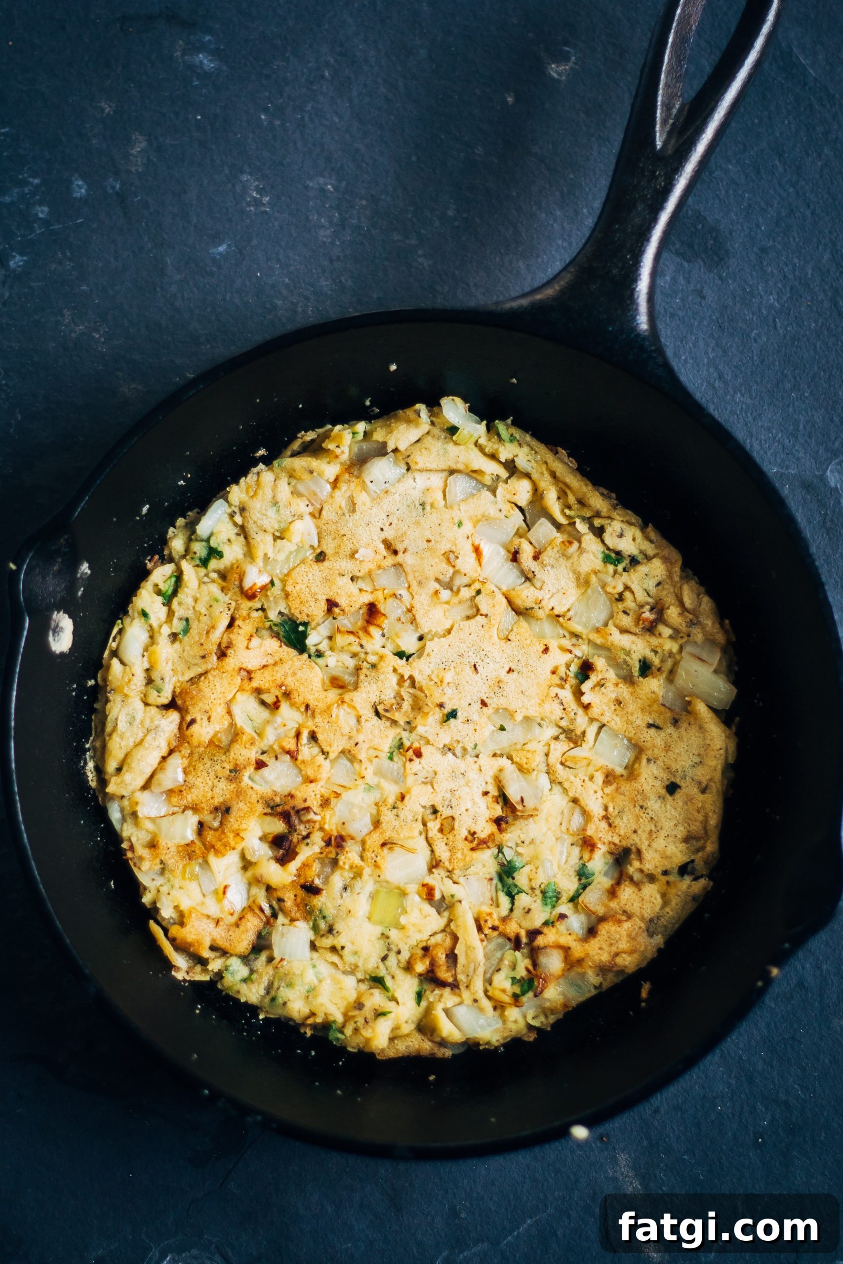 Vegan socca with herbs and sautéed vegetables