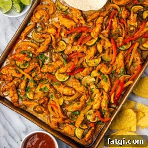 Sheet Pan Chicken Fajitas with Peppers and Onions 15 Chicken fajitas on a large sheet pan served with chips and salsa.