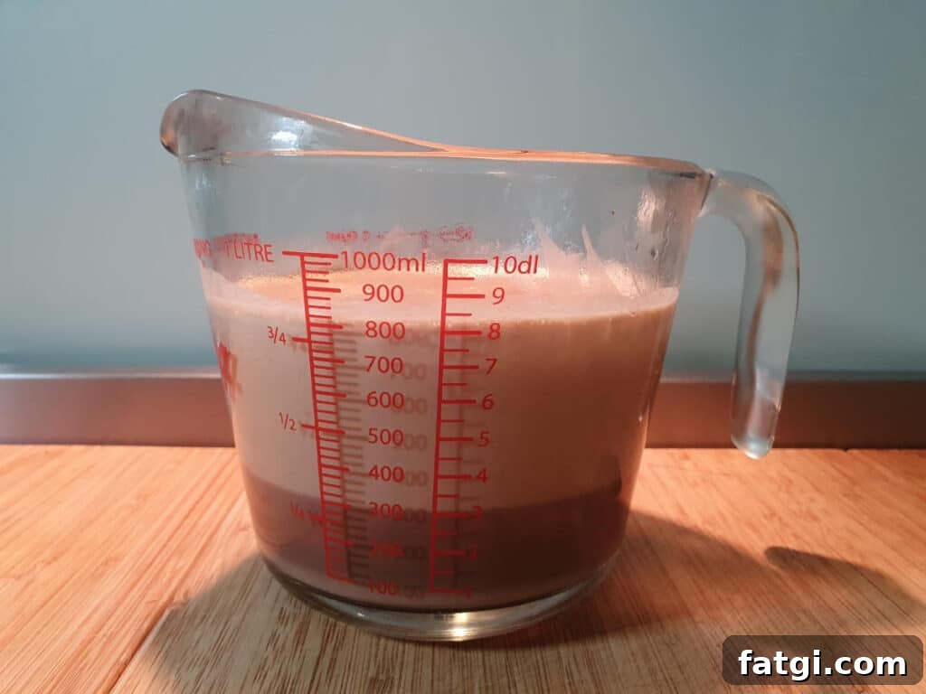 chilled ice cream mix that has separated a little and needs to be stirred before churning.