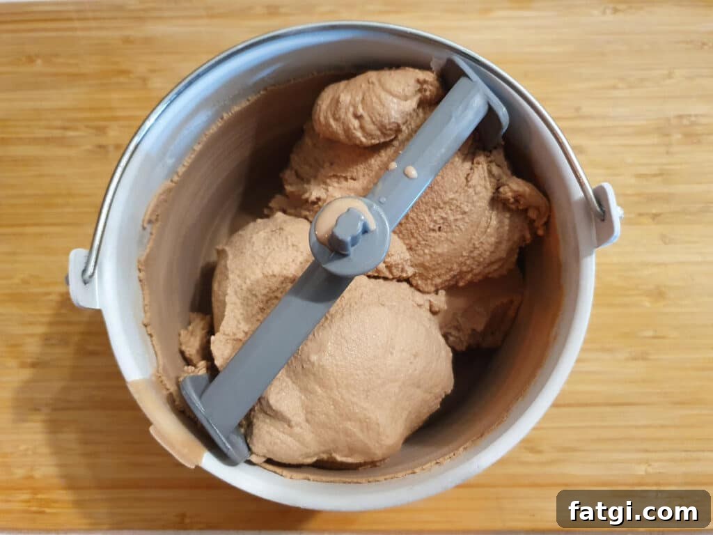 top down view of churned milo ice cream in churning bowl.