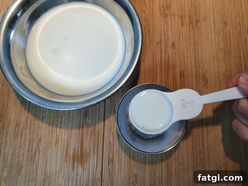 adding milk to tapioca starch in small bowl to make a slurry.