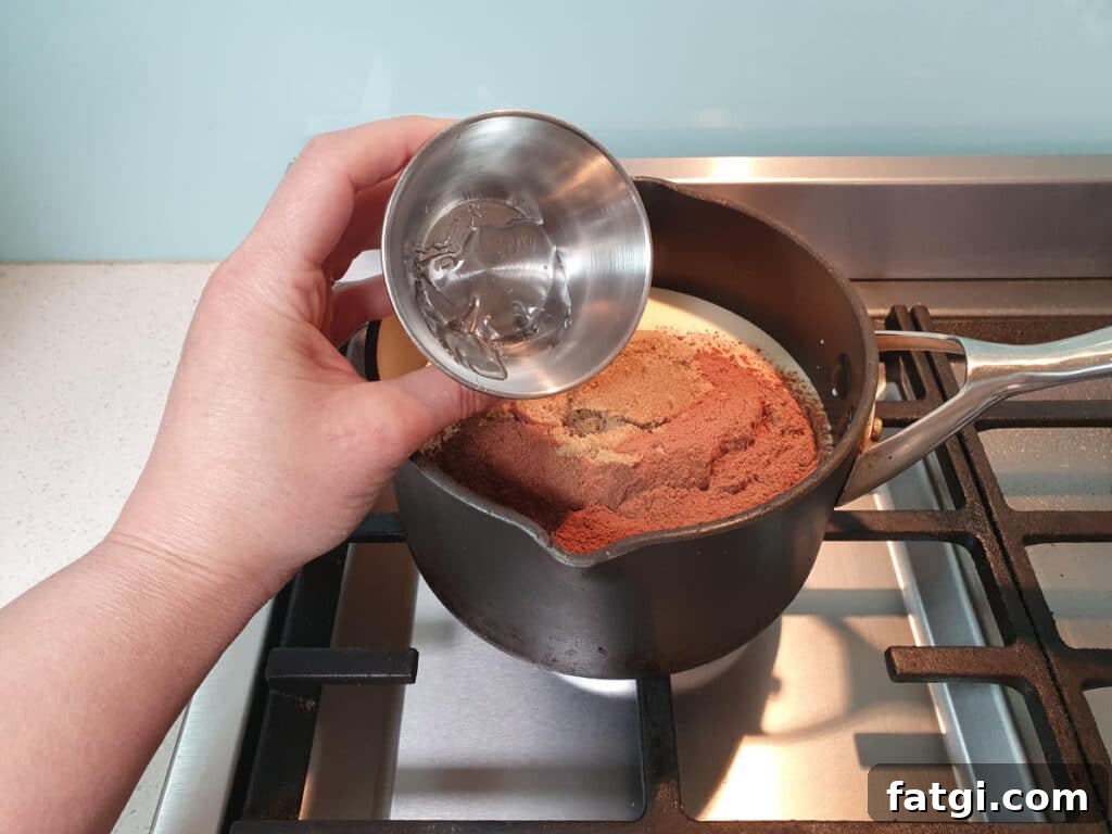 adding optional glucose to ice cream mix in pot on stove.
