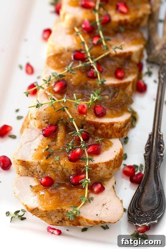 Instant Pot Pork Tenderloin with Balsamic Apples 4 Sliced Balsamic Apple Pork Tenderloin on a white plate with silver fork