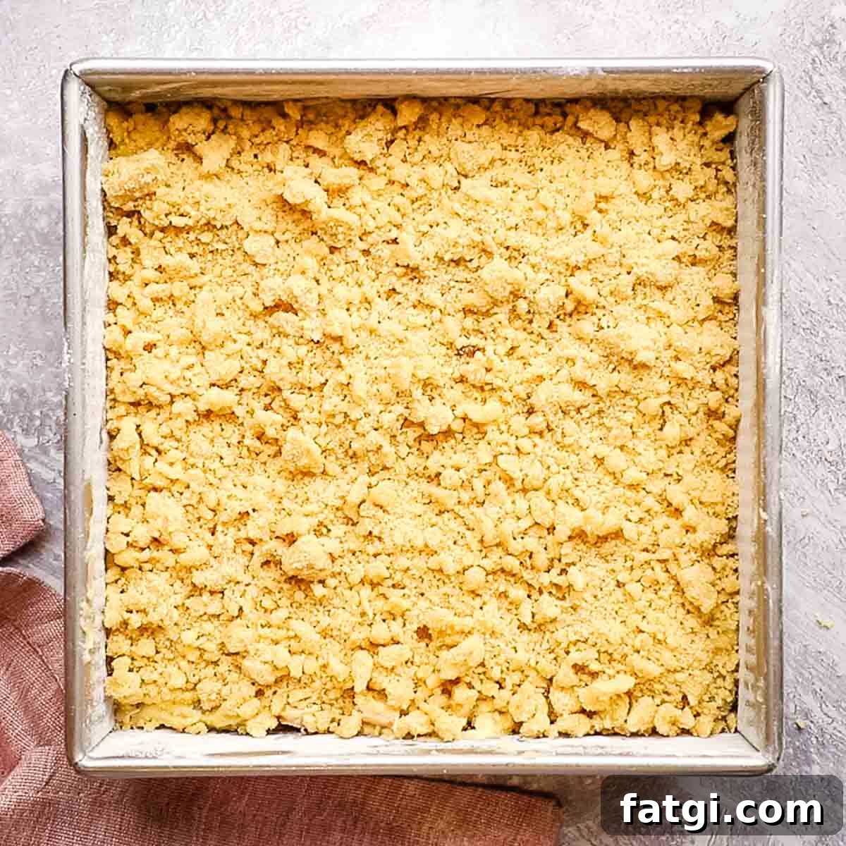 rhubarb coffee cake with crumb topping ready to be baked