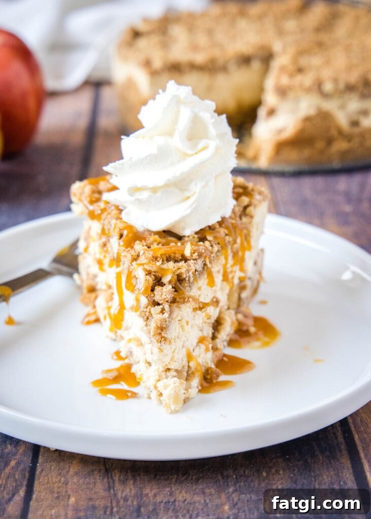 apple cheesecake on a plate with whipped cream