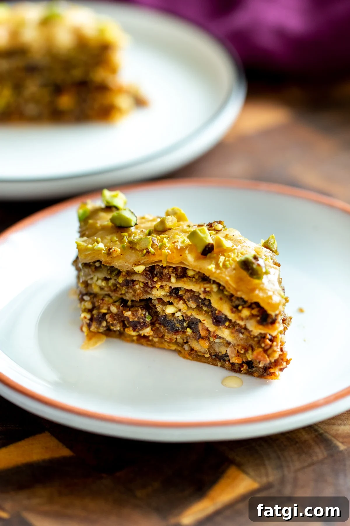 Vegan Baklava with Date and Nut Filling 3 a small piece of vegan baklava on a small dessert plate