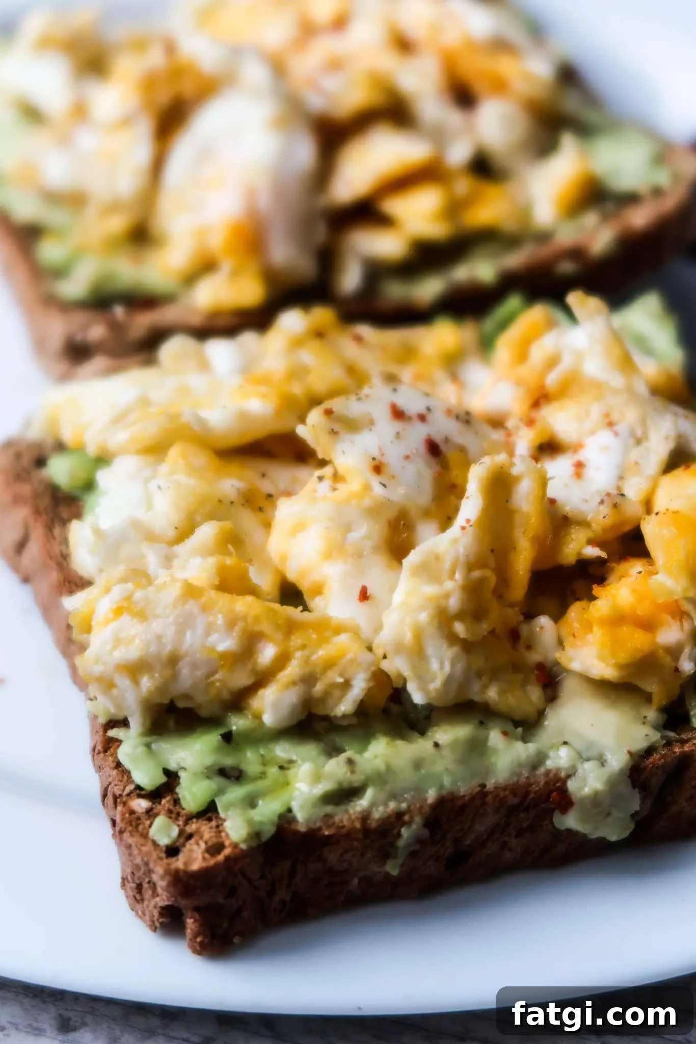 10-Minute avocado toast with egg! This egg and avocado toast recipe is a delicious, easy healthy savory breakfast that you’ll want to make every day. Also a great simple healthy lunch idea with a small salad on the side!