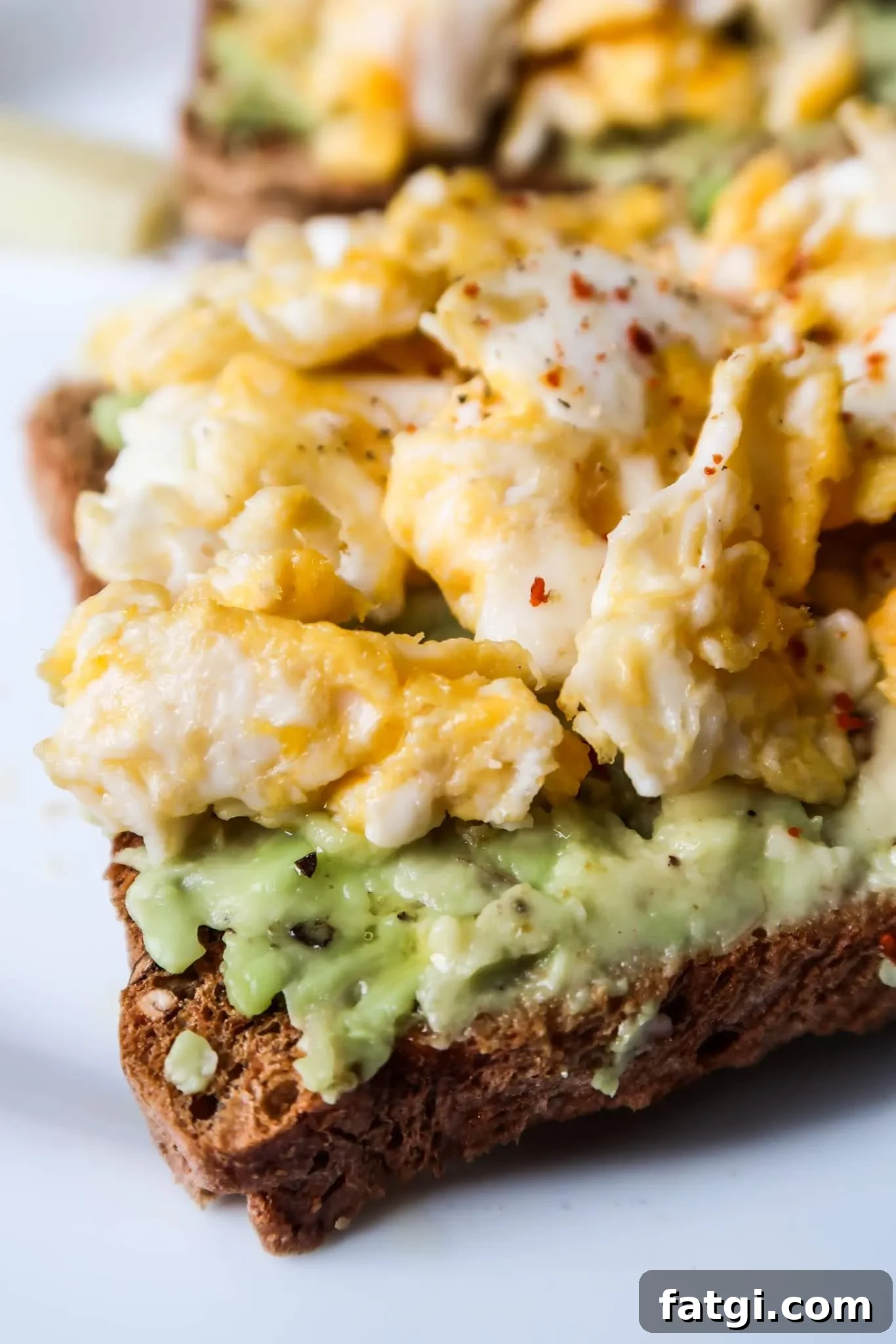 10-Minute avocado toast with egg! This egg and avocado toast recipe is a delicious, easy healthy savory breakfast that you’ll want to make every day. Also a great simple healthy lunch idea with a small salad on the side!