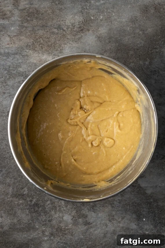 Snickerdoodle cupcake batter in a metal bowl.