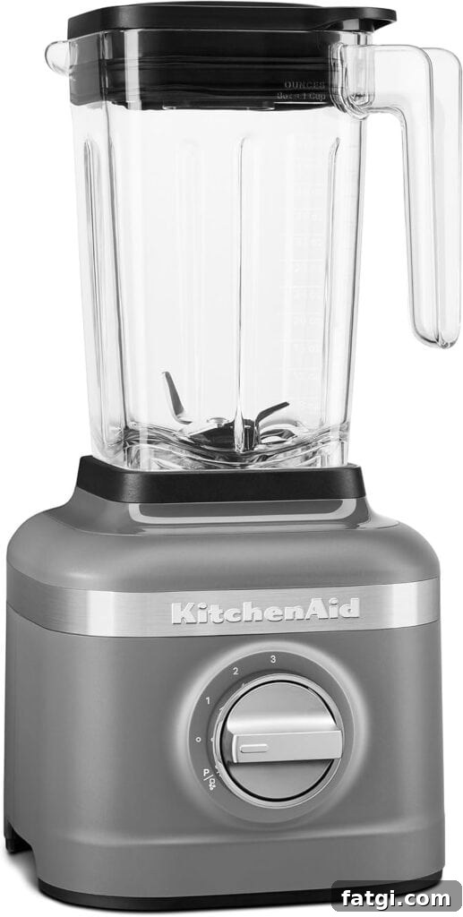 A blender with the words kitchenAid on the body of the blender. 
