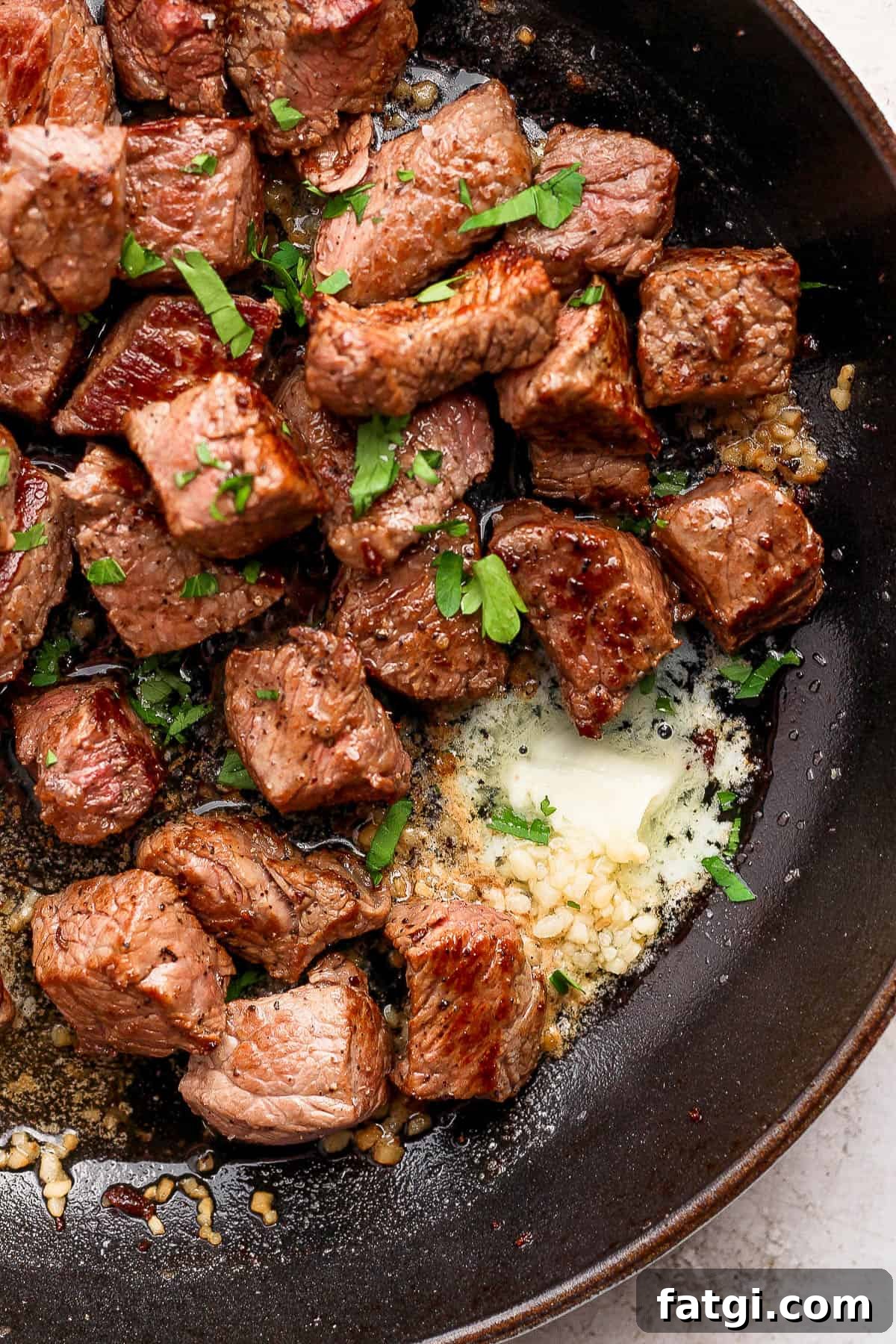 Garlic Butter Steak Bites Recipe 7 Steak bites back in the skillet with melted butter and garlic.