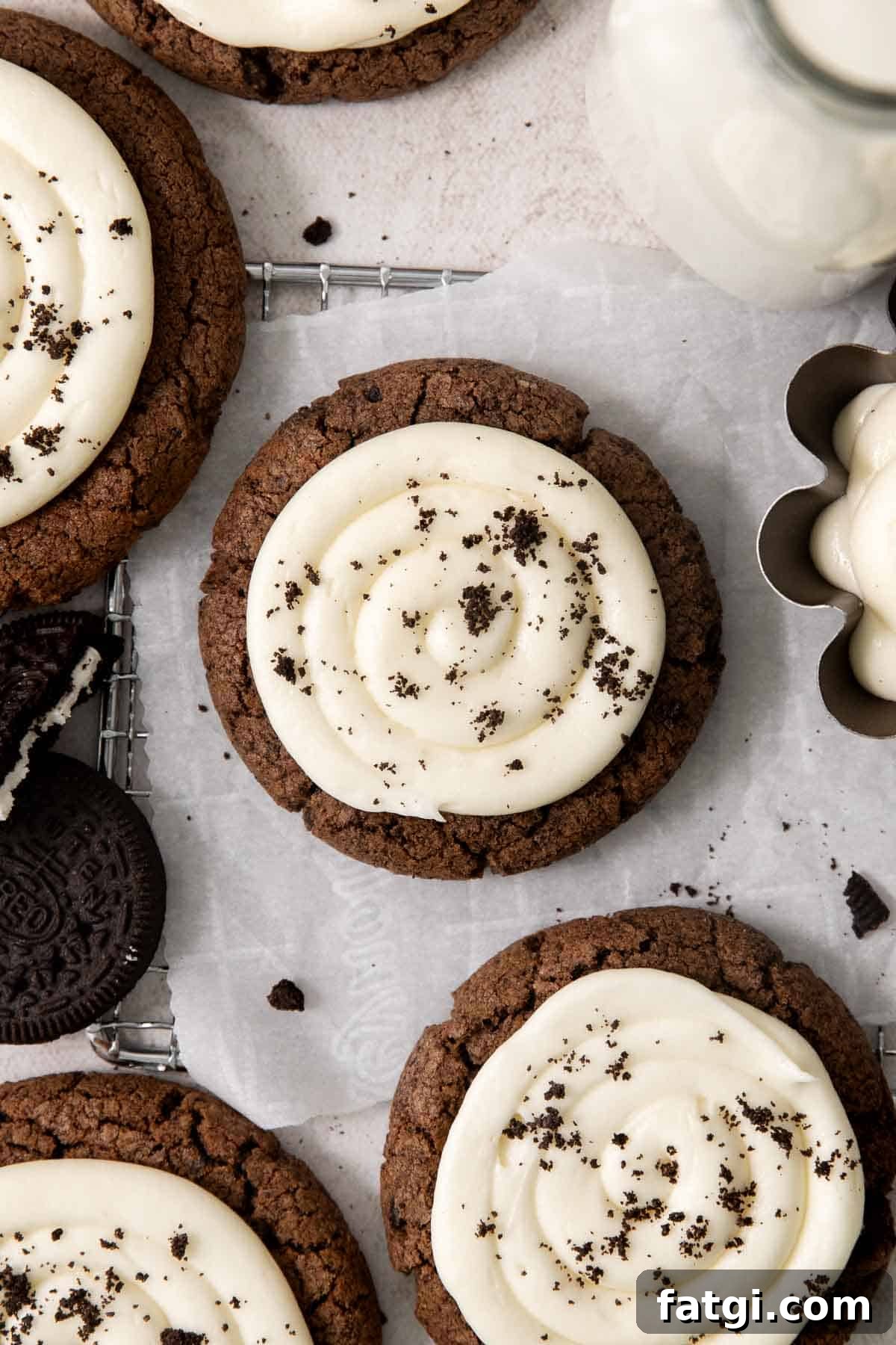 gluten-free Oreo Crumbl cookies on a wire rack with parchment paper
