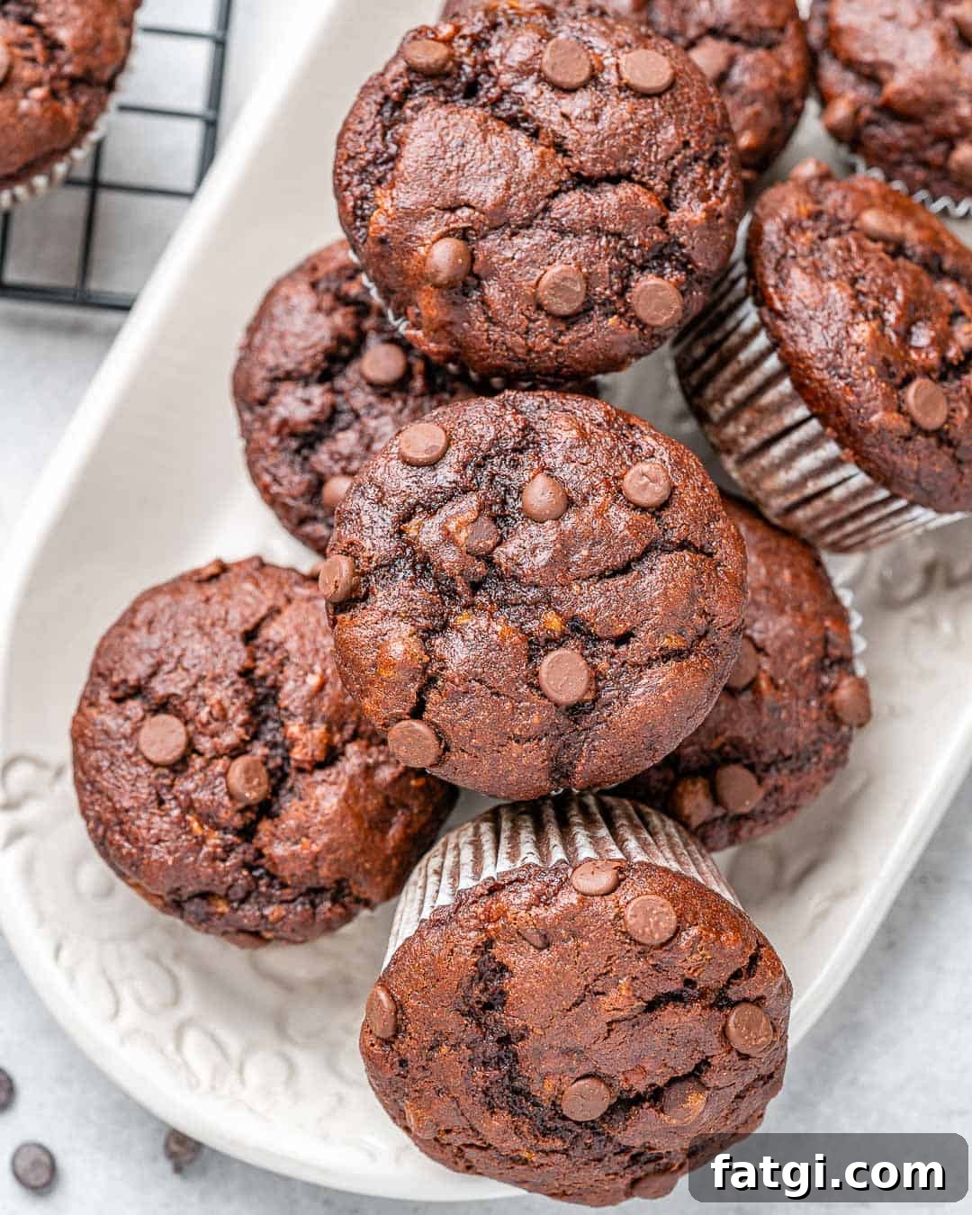 top view of chocolate muffins on a white platter