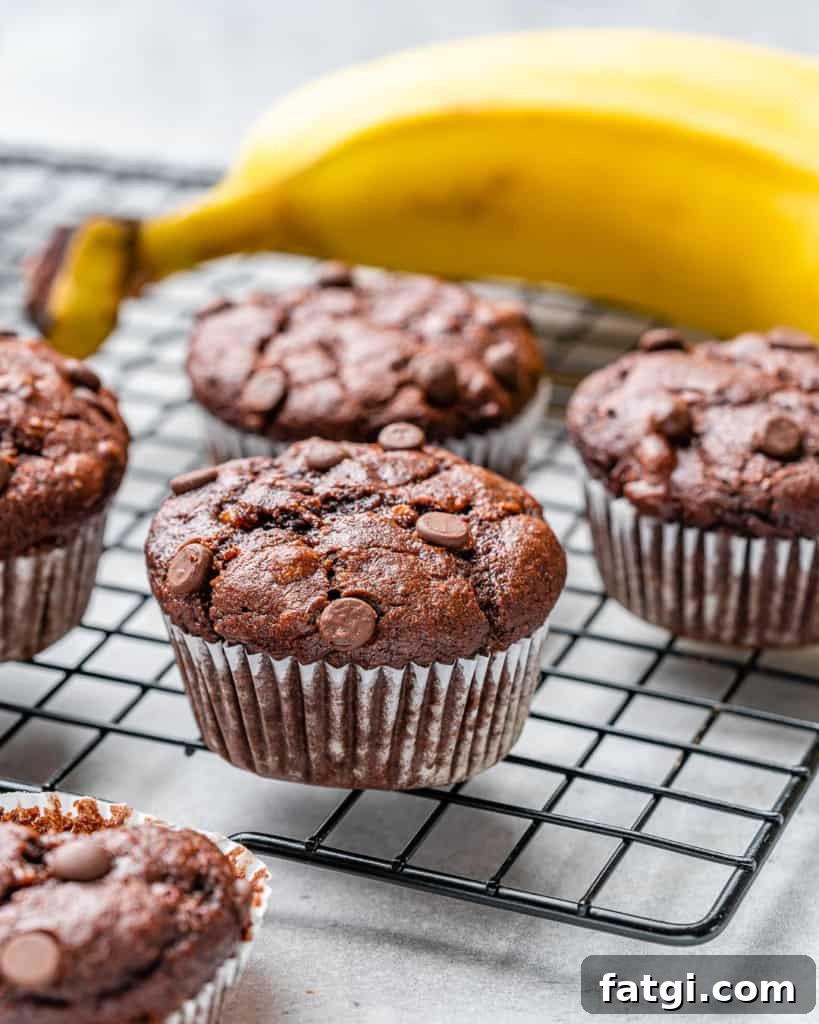 side shot chocolate banana muffins on a rack