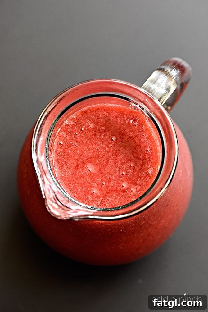 Homemade Strawberry Syrup Recipe for Pancakes and Drinks 3 Fresh strawberry syrup in a jar ready to serve