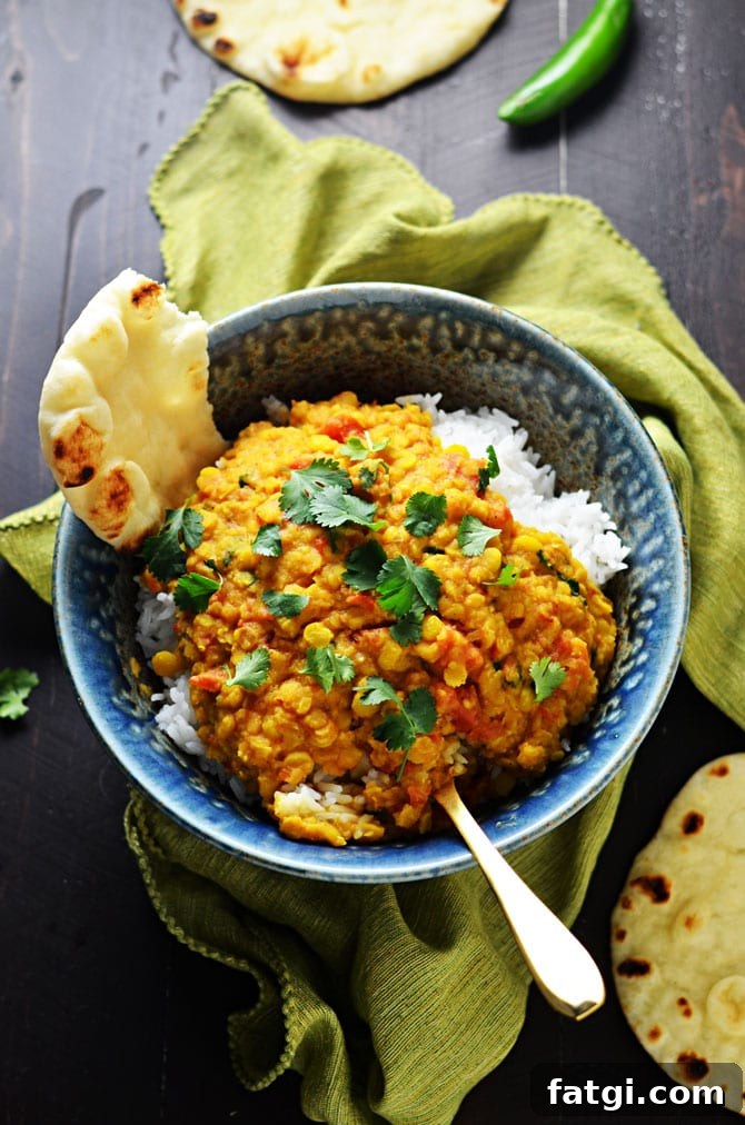 Slow Cooker Indian-Spiced Lentils. This crock pot dahl recipe is hearty, heavily spiced, and ultra-comforting. It doesn't require any crazy techniques, but winds up so flavorful! | hostthetoast.com